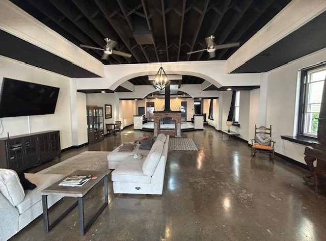 Adaptive reuse conversion with exposed timber cathedral ceiling and polished concrete floor, by Mount Vernon Construction